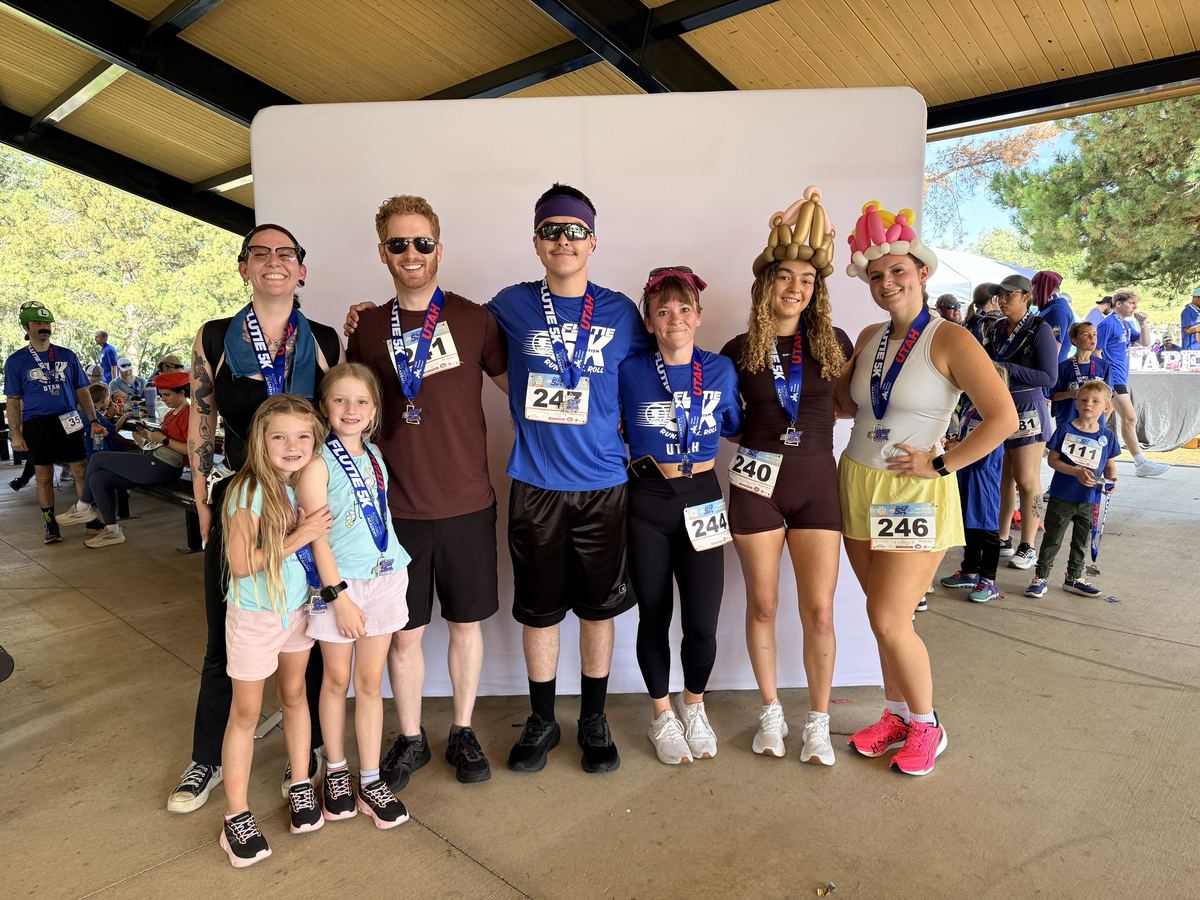 Clarity team members and families celebrating at a community fun run