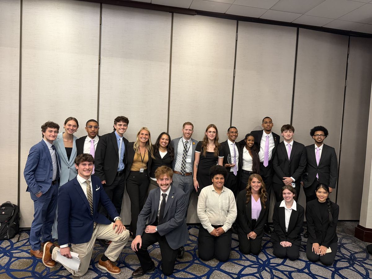 The full Clarity Acquisitions team posing together at a company event