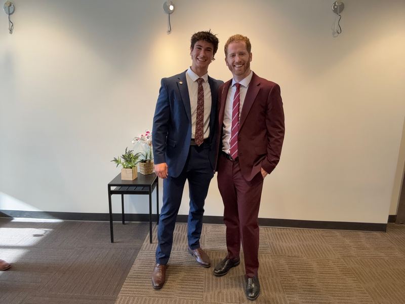 Dustin Harward celebrating Carter's promotion at the Clarity Acquisitions office