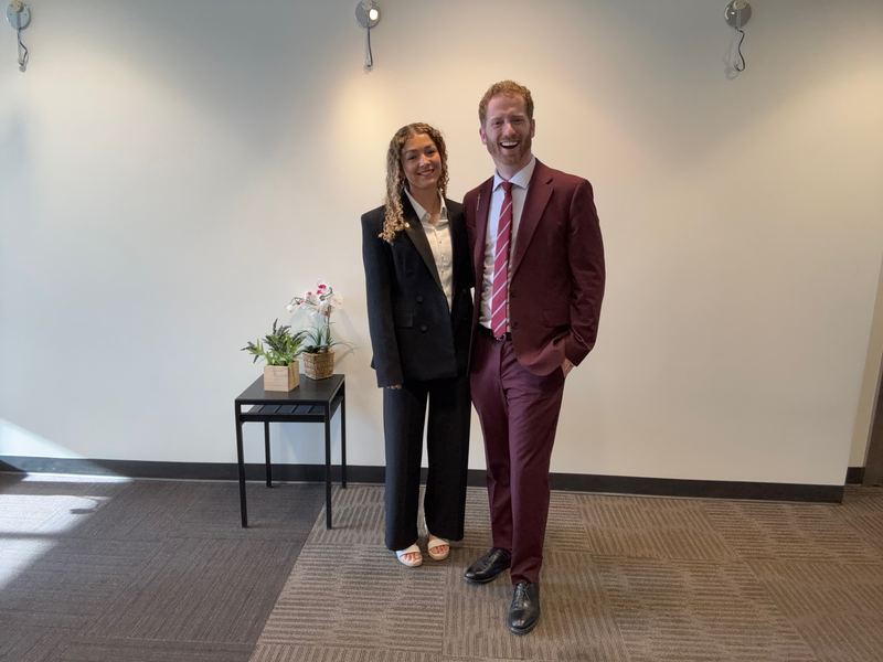 Kenzie, a newly promoted Clarity leader, with Dustin Harward in the office