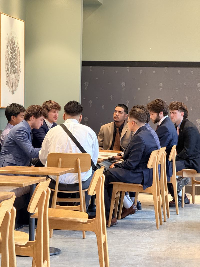 Clarity team huddle at a cafe