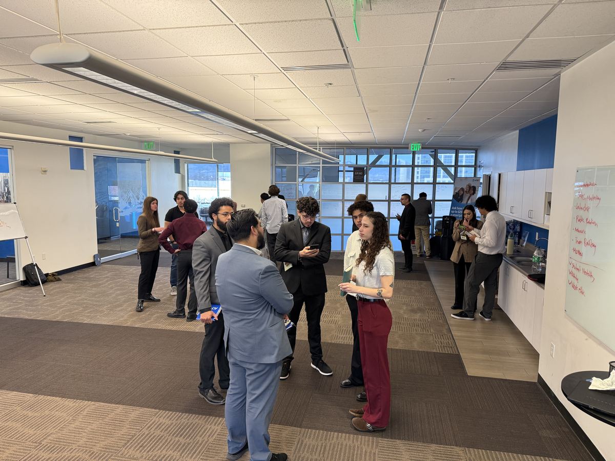 Clarity team members networking and practicing during an office training session
